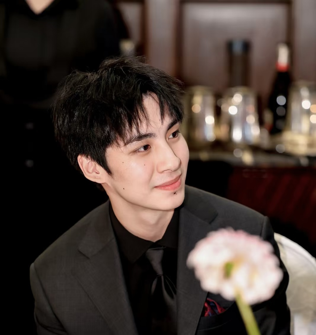 Forest Wu dressed formally