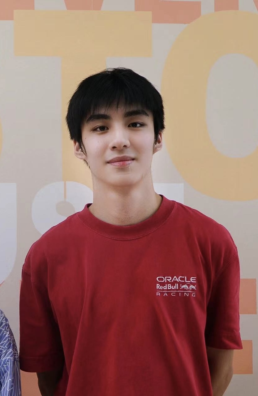 Forest Wu wearing a red shirt