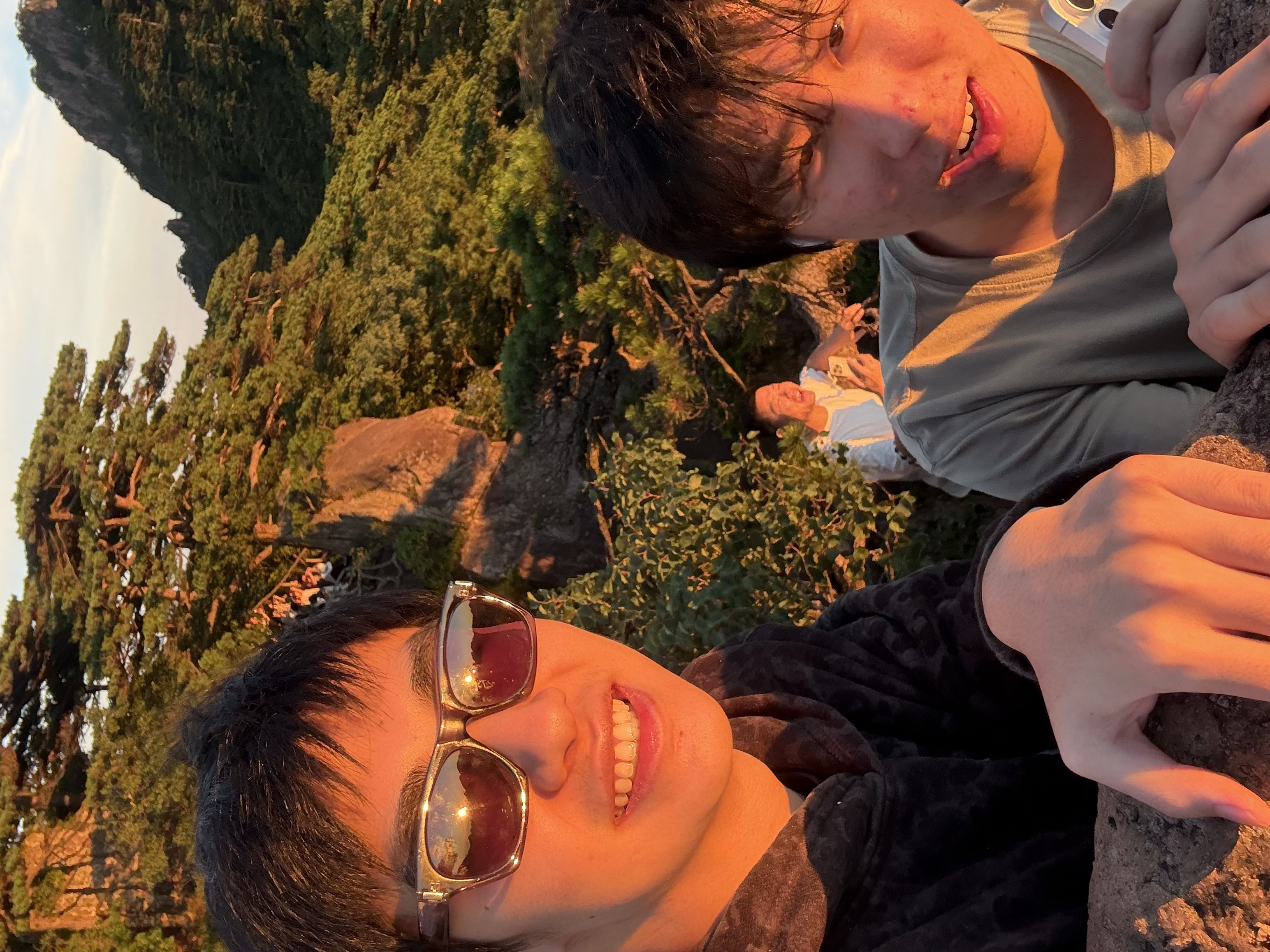 Forest Wu hiking with friends at sunset